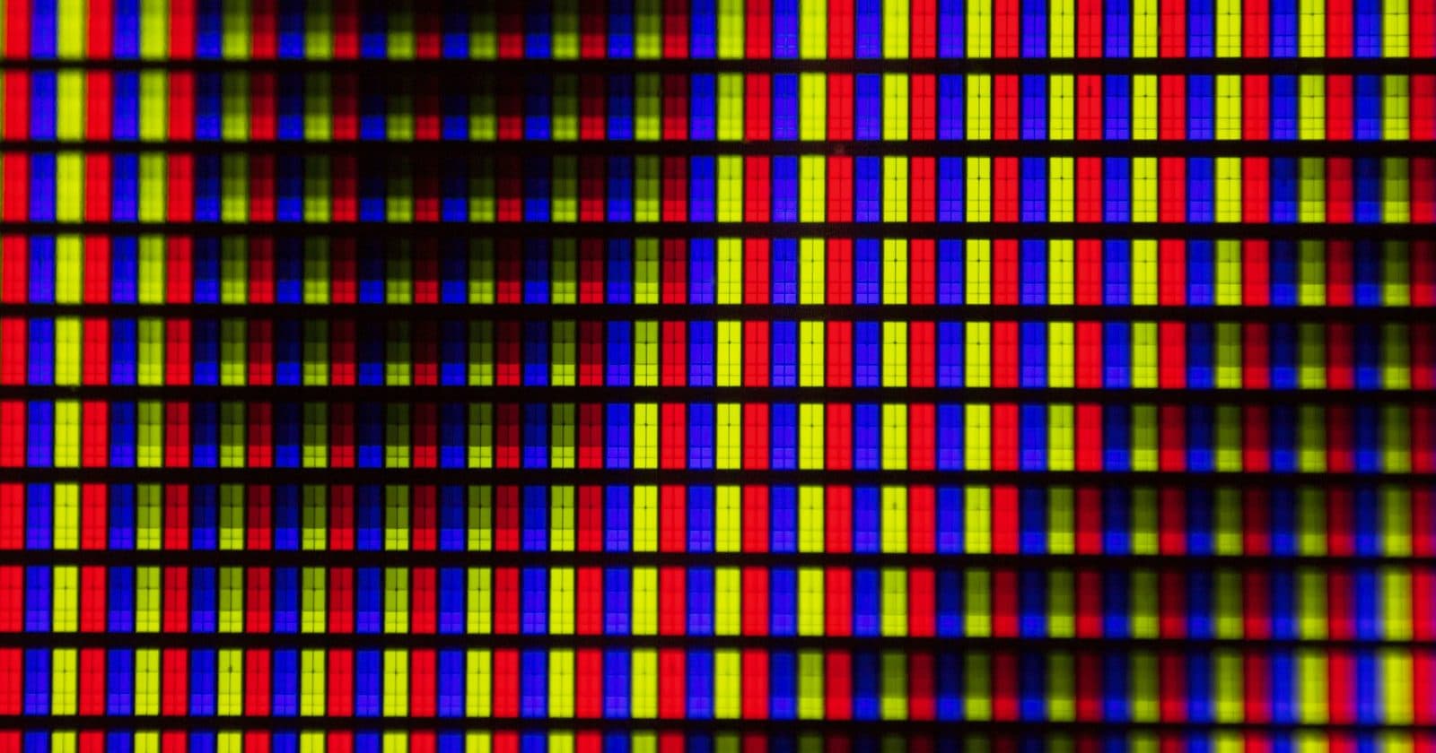 Extreme close-up of an LED display showing the red, green and blue subpixel grid