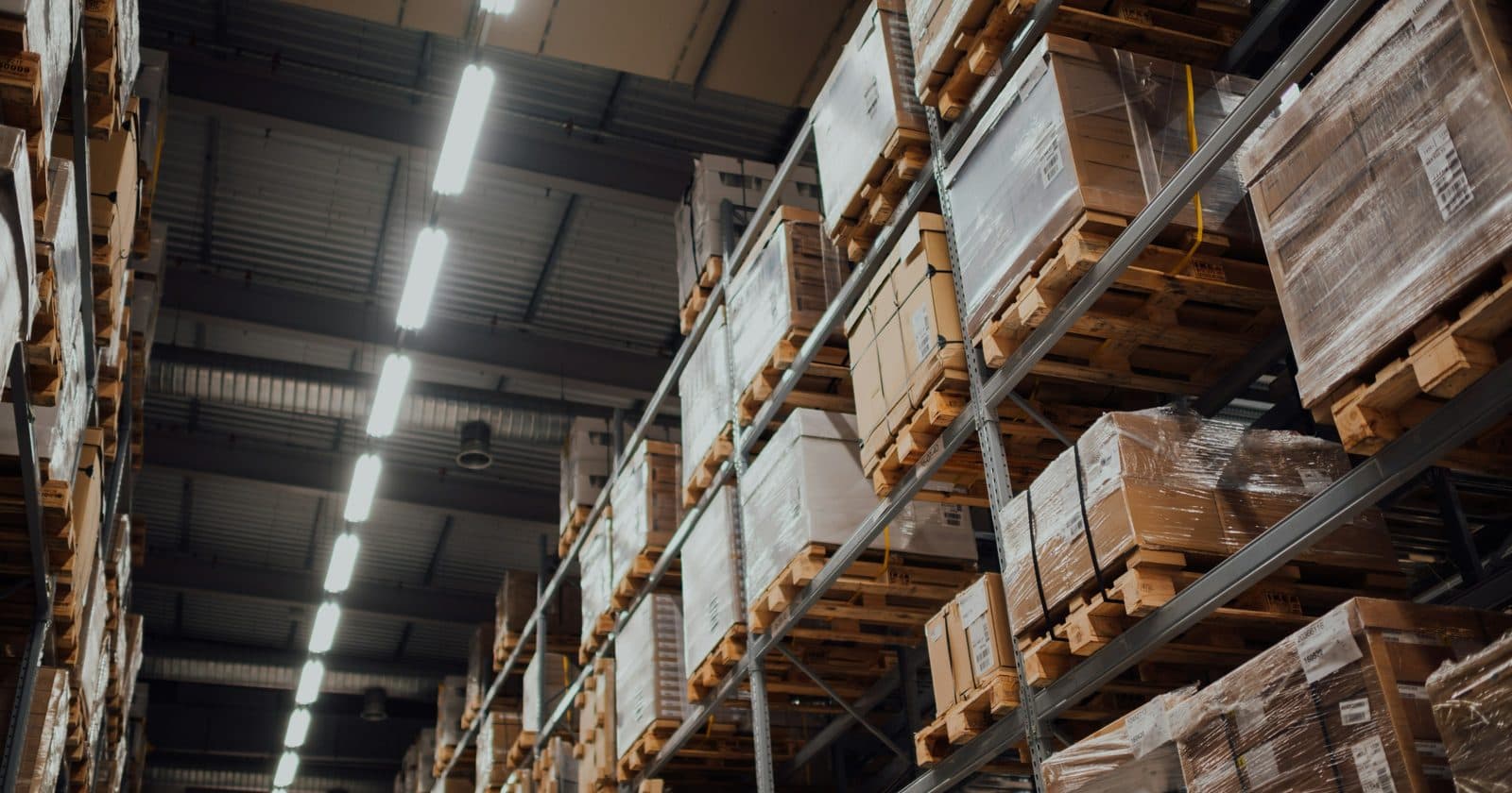 Boxed equipment stored on metal racking in a warehouse